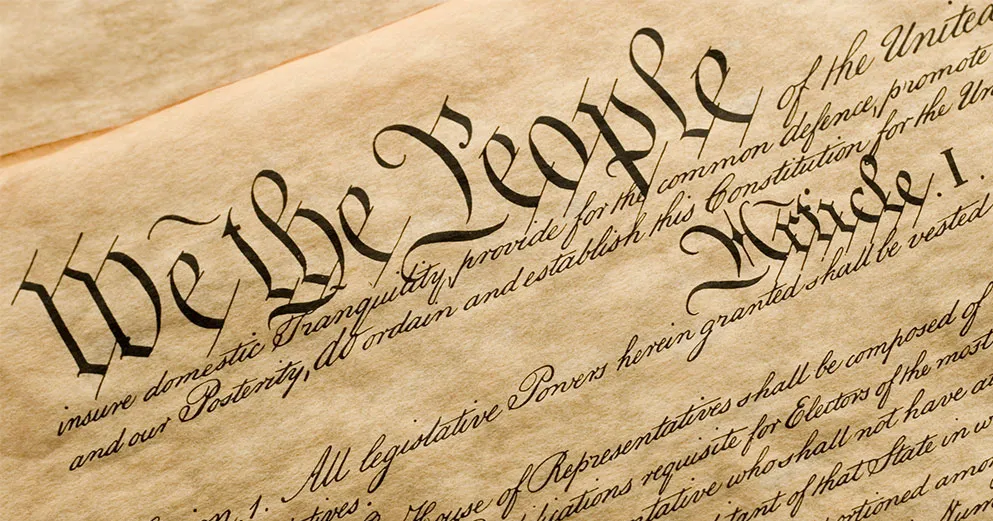 Top corner of the United States Constitution highlighting We the People